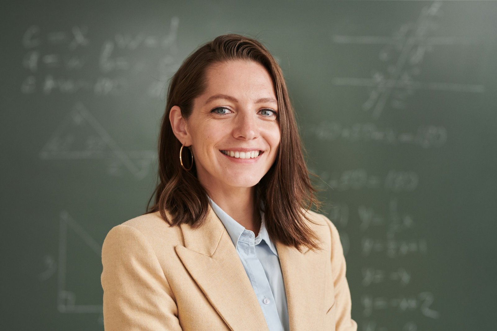 Smiling Female Teacher in School